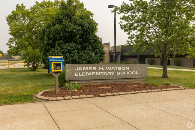 James H Watson Elementary School sign next to a shared library, Schererville, IN.