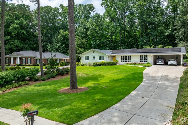 This spacious mid-century ranch sits on a wide, manicured lot in Sagamore Hills.