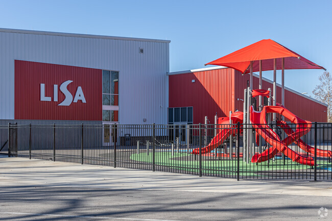 Kids at LISA Academy Rogers - Bentonville Elementary School enjoy the large outdoor playground.