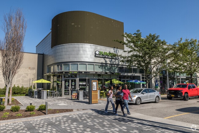 Locals indulge in culinary delights and drinks at the bustling eateries in Stonebridge.