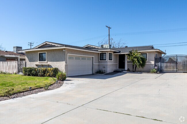 The big driveway and garage are perfect for a car enthusiast.