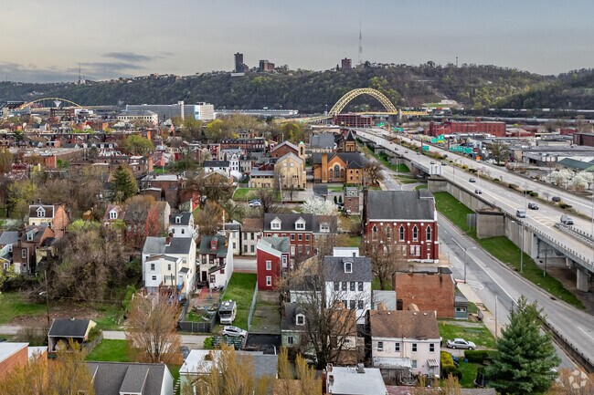 Follow Route 65 around the side of Manchester back toward Pittsburgh.