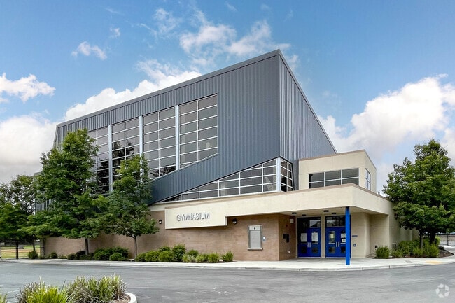 Herman (Leonard) Intermediate School gymnasium is located on a large campus.