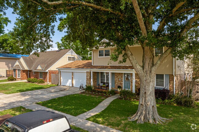 Large trees provide Bissonet Plaza neighborhood homes shade from the southern sun.