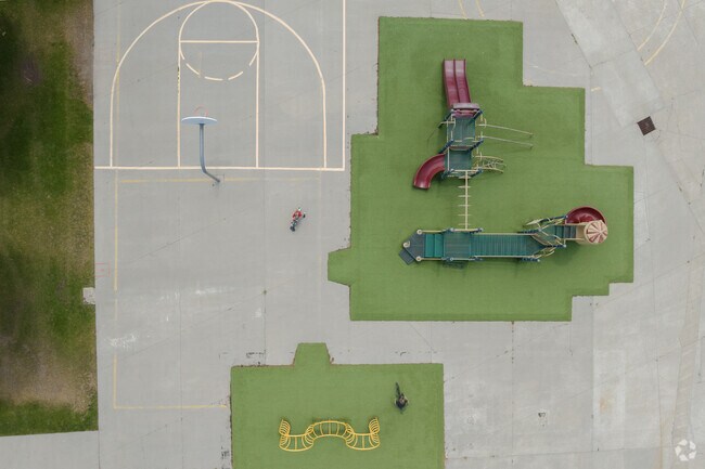 Colorful playgrounds and a basketball court at Rosecrest Elementary School.