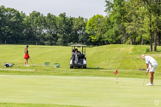 Locals can practice their swing at Chenequa Country Club Golf Course near Merton Town.