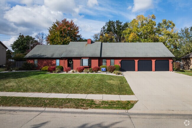 This ranch is outfitted with a three-car garage in New Glenwood.