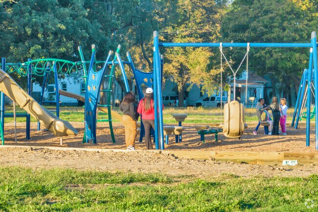 Garfield Park brings joy to young friends as they play together on the playground.