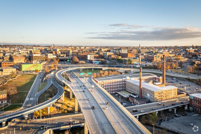 From above, Downtown Fall River showcases its charm, intersected by a bustling highway.