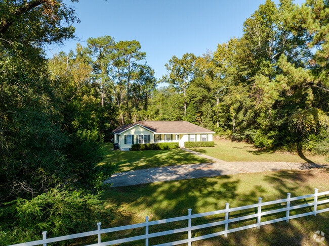 Wooded living offers all the modern amenities with plenty of room to grow in West Tallahassee.