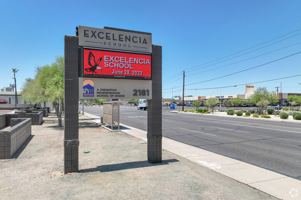 The Excelencia School signage is visible from McDowell Road in central Phoenix.