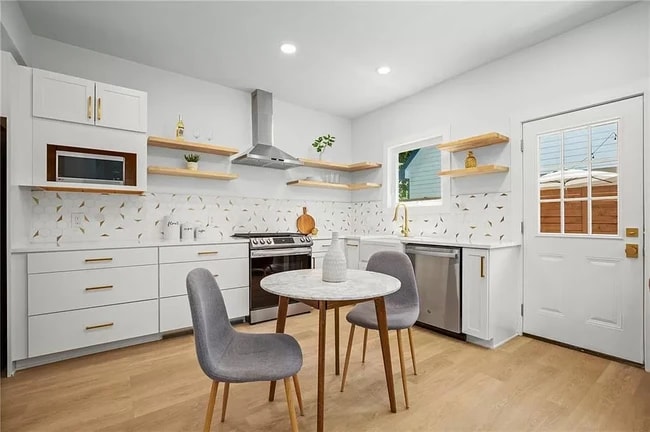 Stainless steel appliances include Gas Stove, Refrigerator, and efficient Dishwasher.