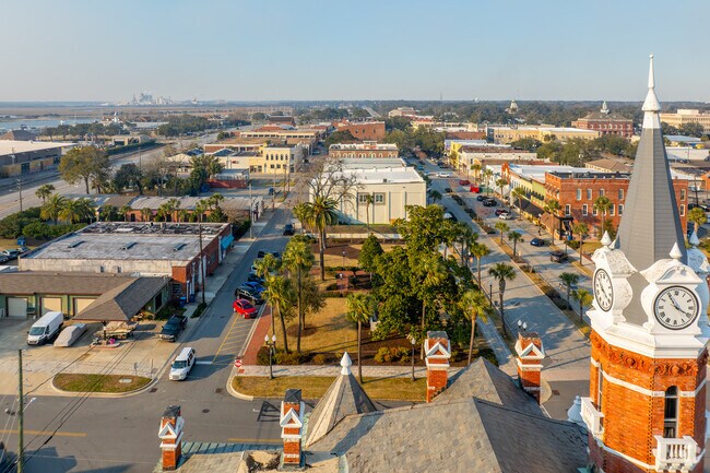 A stunning aerial view of Brunswick’s streets, river, and bustling ports.