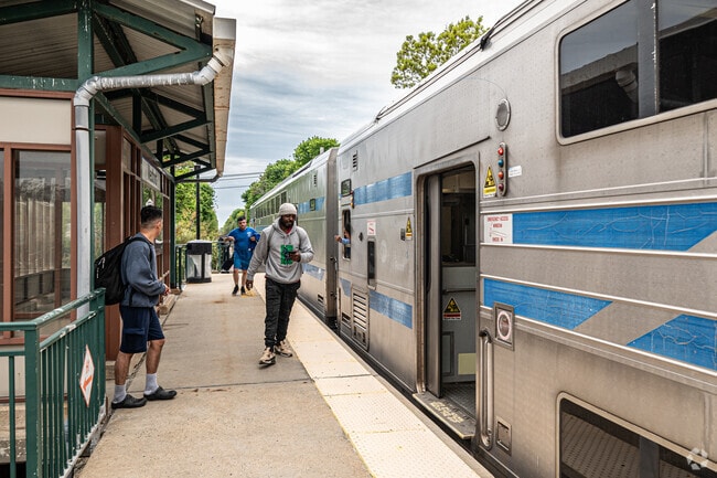 Commuters board the train at Medford Railroad Station.