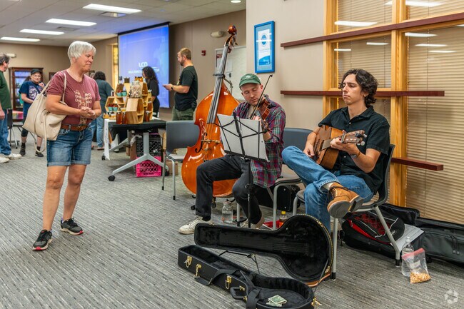 Visitors to the Cedar Falls Food Festival are greeted by musical entertainment.