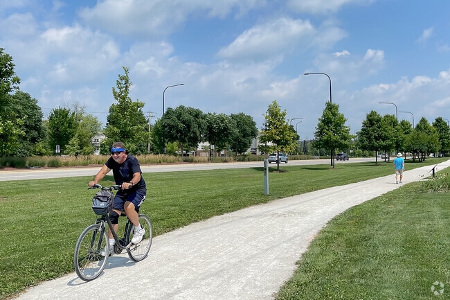 A reside of Warrenville enjoying a bike ride through the city center along Illinois Prairie Path