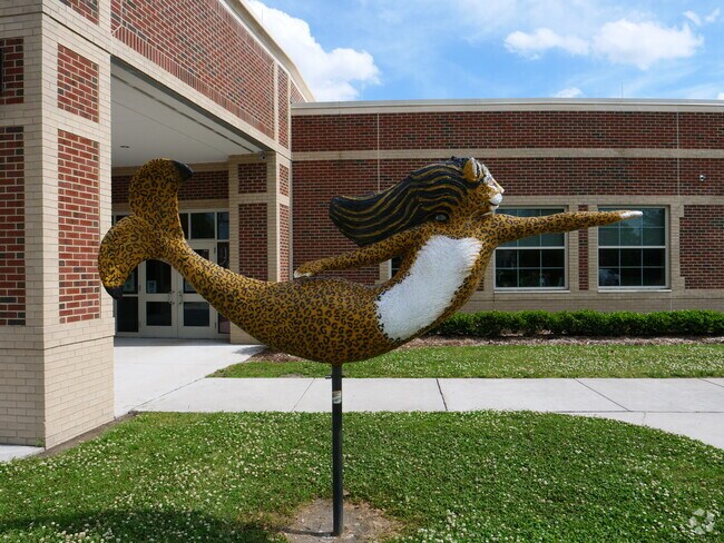 A classic Norfolk mermaid sculpture can be seen outside of Larchmont Elementary School.