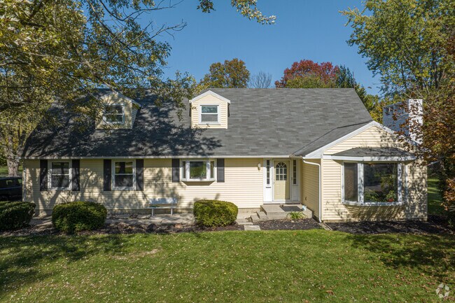 Cape Cod-style houses with dormer windows can be found in the Greentree neighborhood.