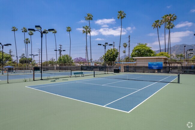 Locals come by Fremont Park in Glenwood for a quick match of tennis.