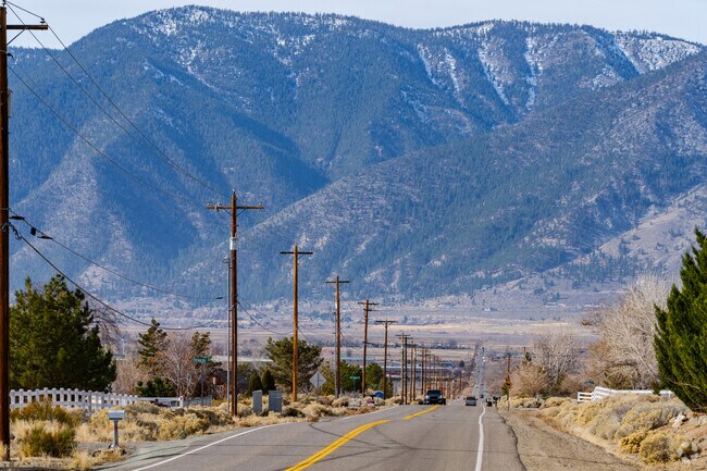 Towering mountains create a dramatic backdrop for Johnson Lane.