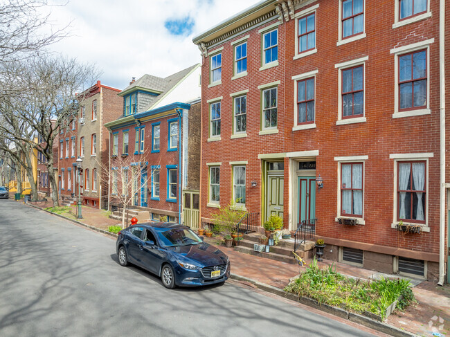 Quiet tree lined streets with historic homes are common in Mill Hill.