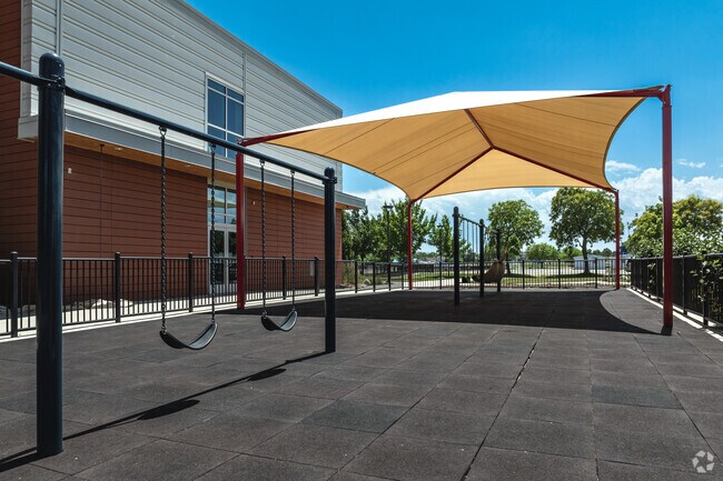 Hartvigsen School’s shaded playground is equipped with adaptive swings.