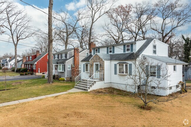 Packanack Lake boasts a picturesque row of charming houses, adding to its quaint allure.