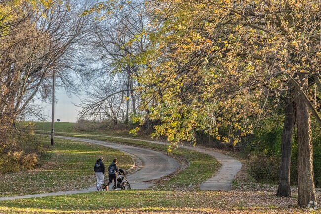 Residents of Greater Sandburg are often seen hiking on the paved path at Sandburg Woods.