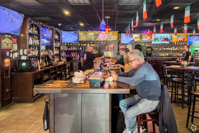 Neighborhood favorite Doyle's Pour House serves fresh food, drinks, and plenty of TVs to watch.