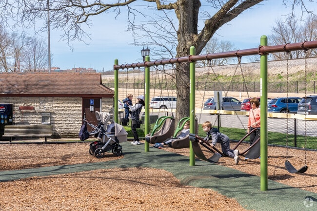 Families enjoy a warm Spring day at Spring Rock Park.