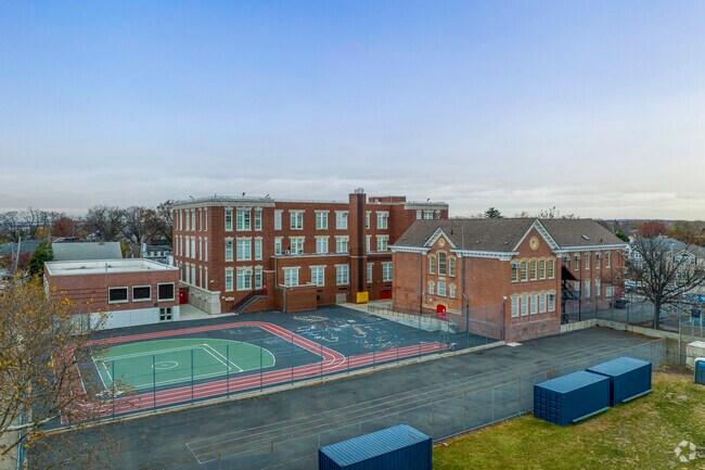 The outdoor spaces include well maintained sports fields.