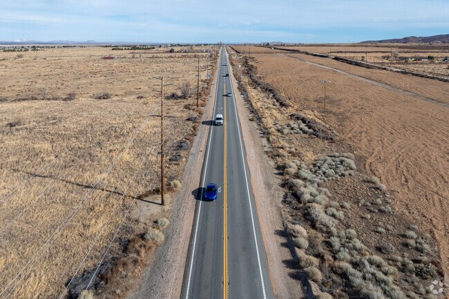 A quiet stretch of Route 138 captures the rugged charm of Northwest Antelope Valley, with endless skies and open roads.