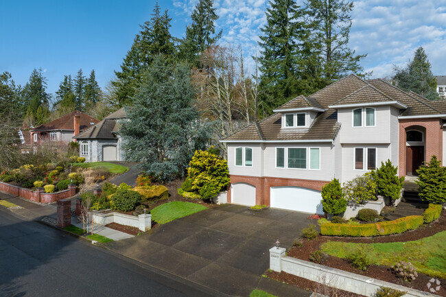 Multistory homes with large garages and driveways in Barrington Heights.