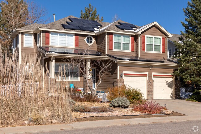 The curb appeal of this Craftsman-style home in Greenfield is off the charts.