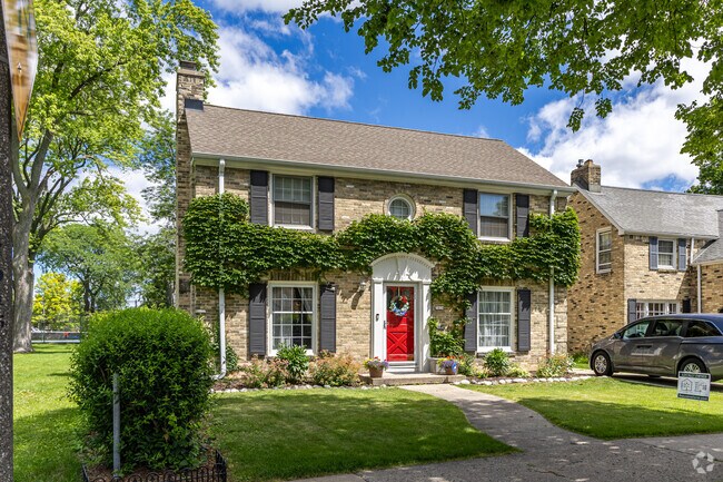 A perfect colonial revival shines in the afternoon sun in Enderis Park.