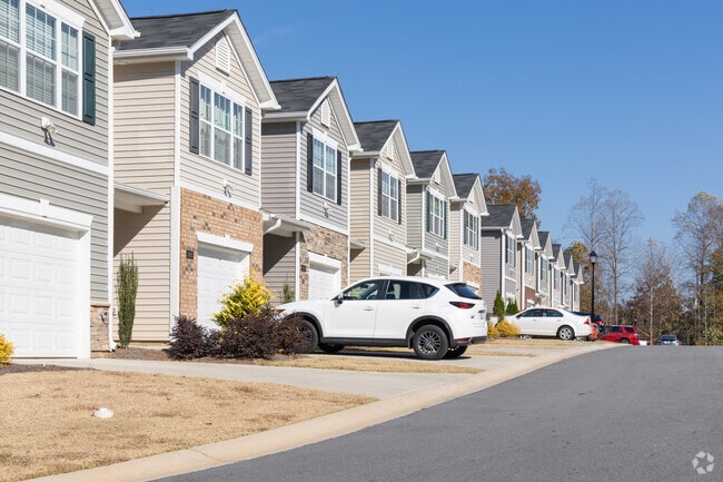 A row of townhomes proudly stand in Reedy Fork Ranch.