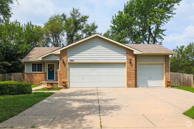 This minimal traditional-style home in North Central has a three-car garage.