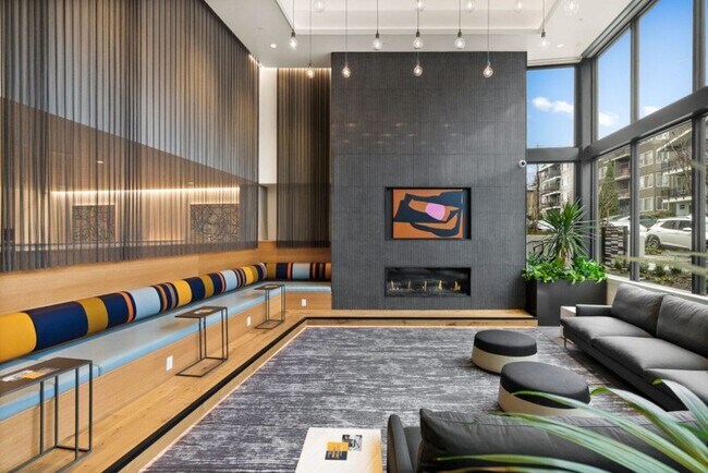 Lounge with fireplace and floor-to-ceiling windows