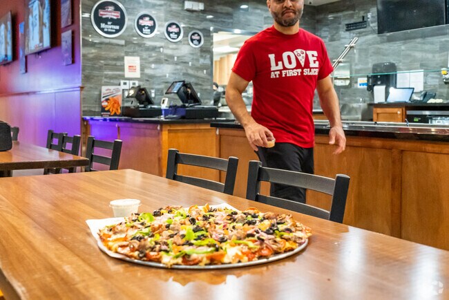 Savor the flavor of fresh-made pizza at Mountain Mike's near Mountain Glenact.