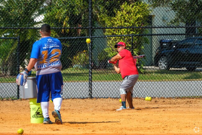Bithlo residents enjoy softball at the nearby community park.