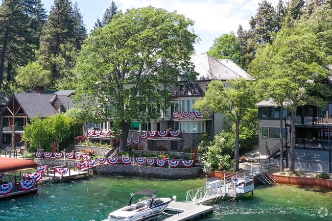 Large estate homes on the waterfront have docks for Lake Arrowhead.