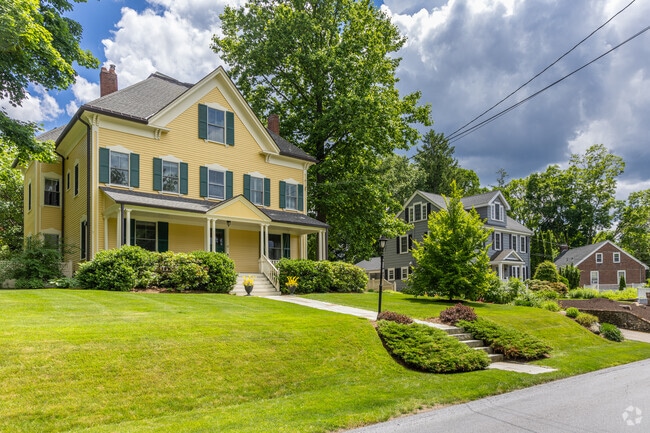 A row of colonial-inspired homes on large lots in Munroe Hill.