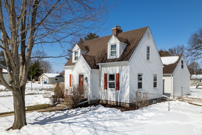 A Cape Cod-style corner house stands in the Sak's Woods neighborhood of Middleton, Wisconsin.