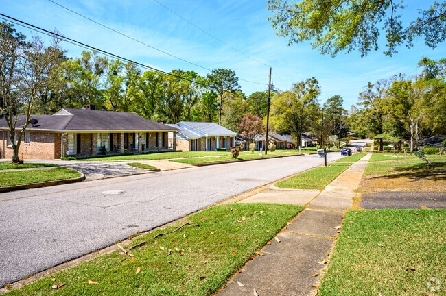 Bellewood residents enjoy a stroll down a quiet street in Mobile.
