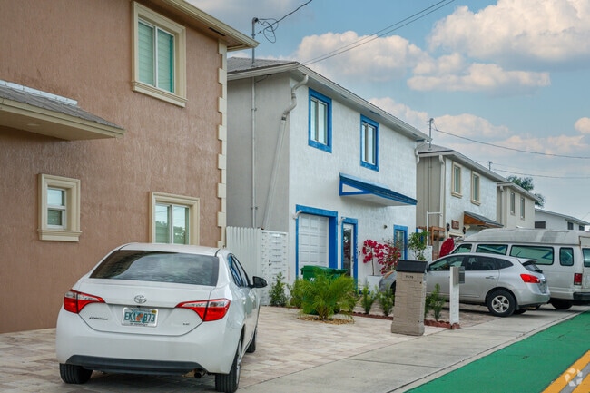Row of small-story homes along a canal in Medley.