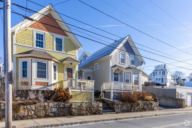 A row of colorful New Englander styled homes in Central Gloucester, MA.