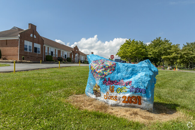 Students help to decorate the school boulder with pride each year at Salem Elementary School.