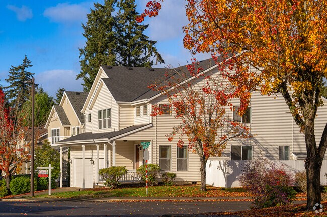 A traditional home is framed by fall colors in East Bull Mountain.