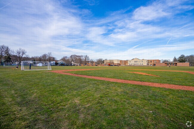 A baseball and soccer field sits behind the Winn Brook Elementary School in Belmont.