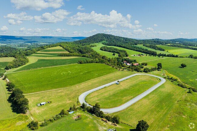 Hawk Mountain rises above Albany with overlooks across farms and forest.